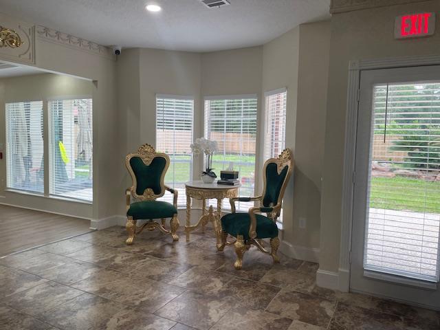 Image of green velvet, ornate, cozy Seating Area in Chateaux Serenity